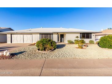 Charming single-story home showcasing desert landscaping and a white exterior at 13234 W Desert Glen Dr, Sun City West, AZ 85375