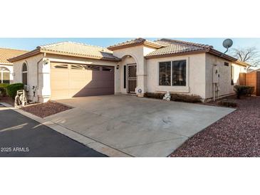 Charming single-story home with well-maintained landscaping and spacious driveway with desert landscaping at 16643 N 19Th St, Phoenix, AZ 85022