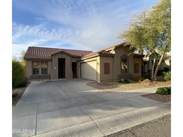 Charming single-story home with desert landscaping, concrete driveway, and inviting curb appeal at 18391 W Stinson Dr, Surprise, AZ 85374