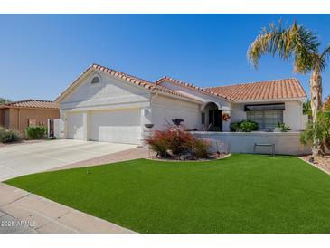 Charming single-story home featuring a three-car garage and well-maintained desert landscaping at 24416 S Lakestar Dr, Sun Lakes, AZ 85248