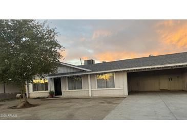 Cozy single story home with attached carport and beautiful sunset view at 3042 N 87Th Ave, Phoenix, AZ 85037