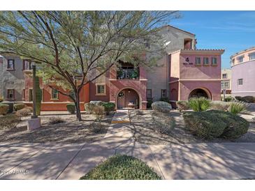 Charming multi-story condo with Southwestern style architecture and landscaped front yard at 3935 E Rough Rider Rd # 1055, Phoenix, AZ 85050