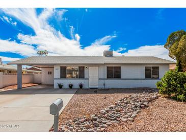 Charming single-story home featuring a covered carport and low-maintenance desert landscaping at 1117 W Mesquite St, Chandler, AZ 85224