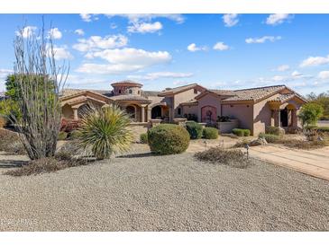 Expansive single-story home with a rotunda entry and a desert-style xeriscaped yard at 27701 N Lucero Dr, Rio Verde, AZ 85263