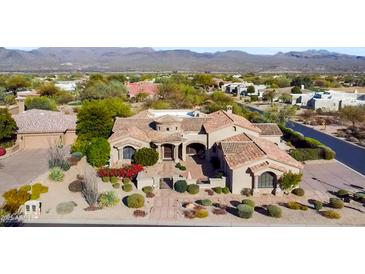 Stunning single-story home with a desert landscape and Spanish tile roof in a beautiful golf course community at 27701 N Lucero Dr, Rio Verde, AZ 85263