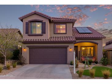 Charming two-story home featuring a desert-landscaped front yard, solar panels, and a two-car garage at 3767 W Desert Creek Ln, Phoenix, AZ 85086