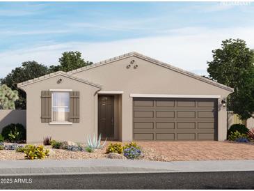 Charming single-story home with a two-car garage, neutral color palette, and beautiful desert landscaping at 8669 W Warner St, Tolleson, AZ 85353