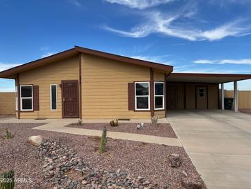 Charming single story home with a covered carport and a low maintenance desert rock yard at 970 W Diamond Rim Dr, Casa Grande, AZ 85122