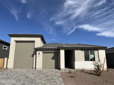 Charming single-story home with a two-car garage and beautiful desert landscaping at 7654 W Tether Trl, Peoria, AZ 85383