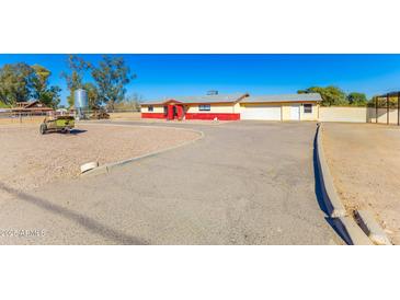 Expansive property with a long driveway and a charming ranch-style home at 10212 S 47Th Ave, Laveen, AZ 85339