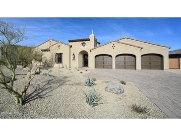 Charming single-Gathering home featuring a three-car garage and desert landscaping at 12870 E Rosewood Dr, Scottsdale, AZ 85255
