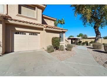 Charming two-story home with desert landscaping, a tile roof, and an attached two-car garage at 5450 E Mclellan Rd # 133, Mesa, AZ 85205