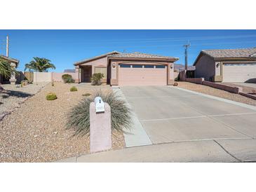 Charming single-story home features a low-maintenance desert-landscaped yard and two car garage at 6760 S Russet Sky Way, Gold Canyon, AZ 85118