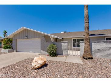 Charming single-story home with a well-maintained front yard and attached garage at 1206 E Greenway Dr, Tempe, AZ 85282