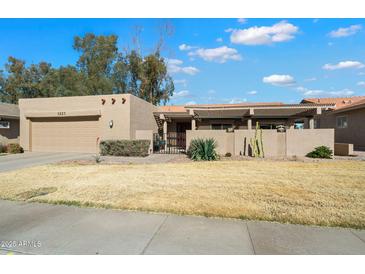 Charming single-story home with a well-maintained front yard and covered front patio at 1222 Leisure World --, Mesa, AZ 85206