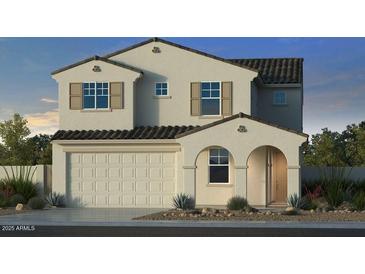 Charming two-story home showcasing a neutral color palette, tiled roof, and a convenient two-car garage at 17573 W Georgia Ave, Litchfield Park, AZ 85340