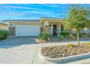 Charming home with a two-car garage and well-maintained landscaping, creating a welcoming curb appeal at 10545 E Texas Ave, Mesa, AZ 85212