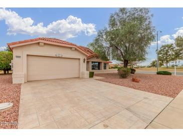 Charming single story home with stucco exterior, tile roof, and well maintained desert landscaping at 20603 N Stonegate Dr, Sun City West, AZ 85375