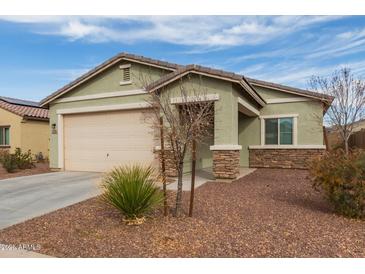 Single-story home featuring a two-car garage and desert landscaping at 274 W Kona Dr, Casa Grande, AZ 85122