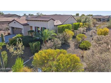 Attractive single-story home with a tile roof and lush desert landscaping at 29816 N 129Th Gln, Peoria, AZ 85383