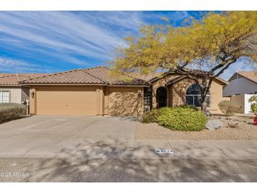 Charming single-story home featuring a well-maintained front yard and a two-car garage at 4514 E Mazatzal Dr, Cave Creek, AZ 85331