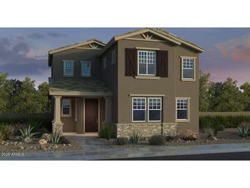 Inviting two-story home with neutral paint, shutters, and a charming front porch at 3821 N 99Th Dr, Avondale, AZ 85392