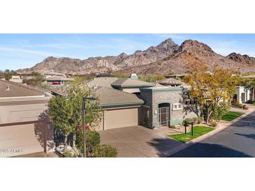 Beautiful desert home with mountain views, stone accents, and a secure gated entrance to the courtyard at 6426 N 27Th St, Phoenix, AZ 85016