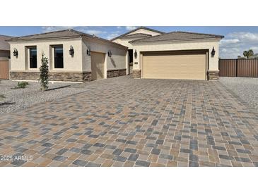 Inviting single-Gathering home featuring a wide driveway and neutral color palette at 1586 N Himosa Dr, Casa Grande, AZ 85122