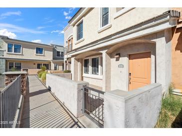 Inviting home featuring a private patio, stucco facade, and charming walkway at 10757 N 74Th St # 1016, Scottsdale, AZ 85260