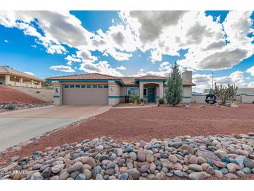 Charming single-story home with well-manicured front yard and desert landscaping at 508 N Sierra Vista Dr, Wickenburg, AZ 85390