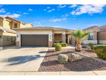 Beautiful single story home with low maintenance landscaping, and inviting color palette at 17193 N Rosemont St, Maricopa, AZ 85138