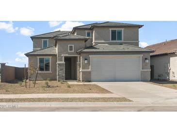 Beautiful two story home featuring a two car garage and low maintenance desert landscaping at 42860 W Palo Abeto Dr, Maricopa, AZ 85138