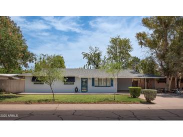 Charming single-story home featuring well-maintained landscaping and a covered parking area at 2121 S Ventura Dr, Tempe, AZ 85282