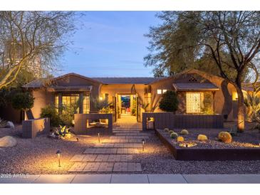 Charming home with desert landscaping, decorative cacti, and inviting pathway at twilight at 59 W Cypress St, Phoenix, AZ 85003