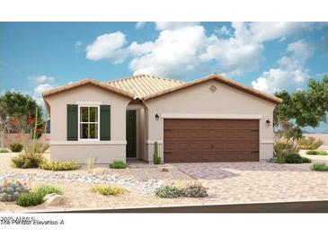 Charming single-story home showcasing desert landscaping, a two-car garage, and a neutral color palette at 39993 W Anne Ln, Maricopa, AZ 85138