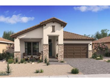 Charming single-story home featuring stone accents, desert landscaping, and a cozy front porch seating area at 550 E Aurora Dr, San Tan Valley, AZ 85140