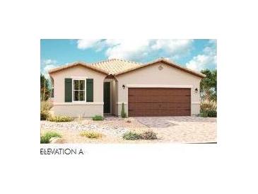 Charming single-story home showcasing a spacious two-car garage and lovely desert landscaping at 21505 N Rummler Ln, Maricopa, AZ 85138