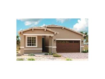 Charming single-story home features a warm color palette, a two-car garage, and low maintenance landscaping at 21525 N Rummler Ln, Maricopa, AZ 85138