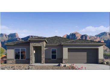 Charming single-story home featuring desert landscaping and a stone-accented entryway with mountain views at 25606 N 154Th Ln, Surprise, AZ 85387