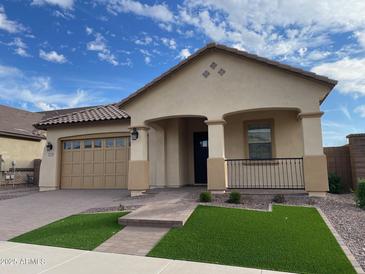 Charming single-Gathering home with a well-manicured front yard and covered porch at 23139 E Canary Way, Queen Creek, AZ 85142