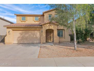 Charming two-story home with a two-car garage and low maintenance desert landscaping at 43524 W Bailey Dr, Maricopa, AZ 85138