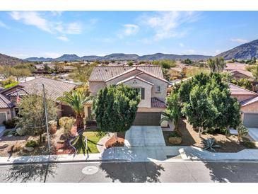 Charming two-story home with well-maintained landscaping and tile roof in a desirable community at 5137 W Quail Track Dr, Phoenix, AZ 85083