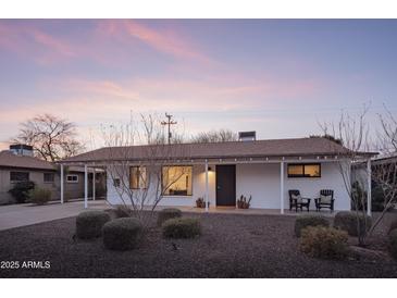 Charming single-story home featuring a covered front porch and desert landscaping at 6114 N 8Th St, Phoenix, AZ 85014