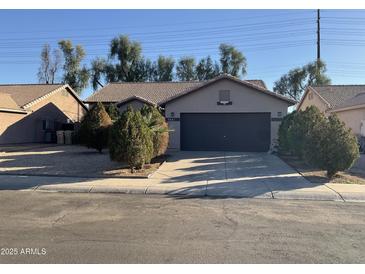 Charming single-story home featuring a spacious driveway and a well-maintained front yard at 7551 W Pasadena Ave, Glendale, AZ 85303