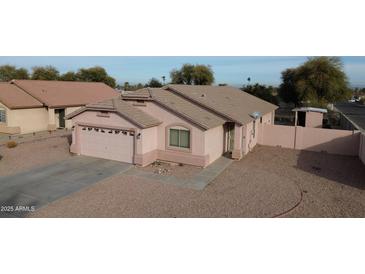 Charming single-story home with a two-car garage and desert landscaping at 1624 W Minton St, Phoenix, AZ 85041