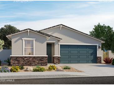 Charming single-story home with a stone accent wall and two-car garage at 17434 W Eva St, Waddell, AZ 85355