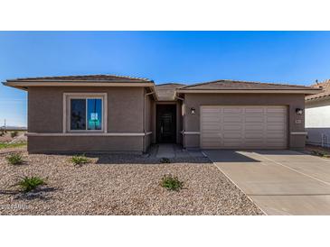 New construction home features a two-car garage, neutral stucco exterior, and low maintenance desert landscaping at 31476 N Hayweather Ln, San Tan Valley, AZ 85143