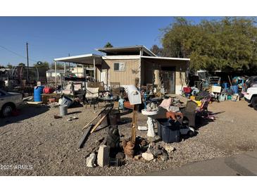 Exterior view of a home showing its front and front yard at 9716 E Birchwood Ave, Mesa, AZ 85208