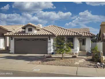 Charming single-story home with a tile roof and a well-maintained front yard at 1734 E Commonwealth Cir, Chandler, AZ 85225