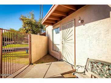 Private gated courtyard with a seating area, providing a tranquil outdoor space at 2140 E Rosarita Dr, Tempe, AZ 85281